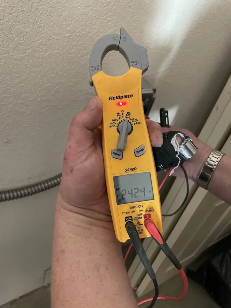 Voltage testing with clamp meter during Outlet Installation in Edgewood